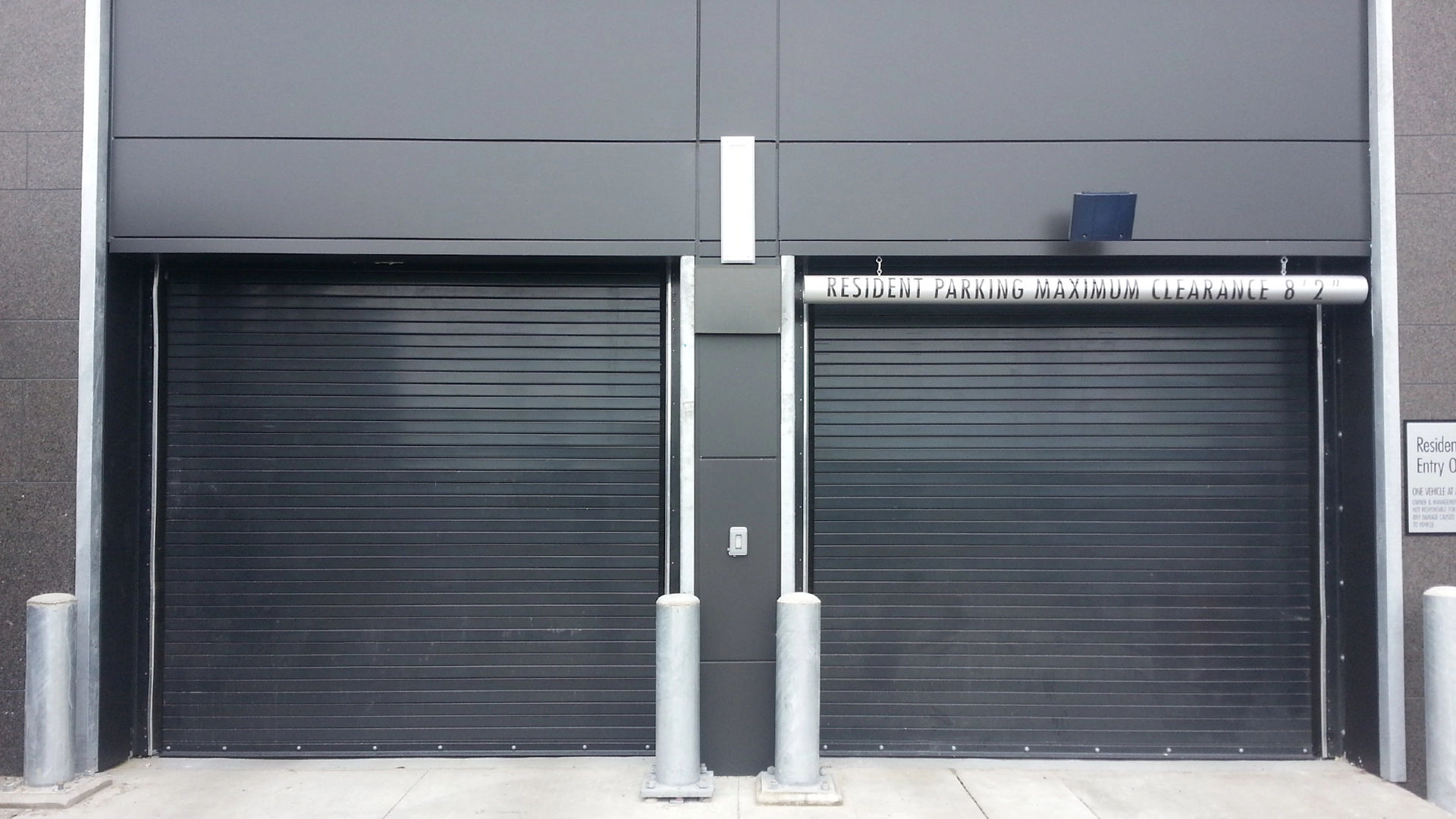 Extreme 1024 High-Performance Rolling Door with black finish on parking garage