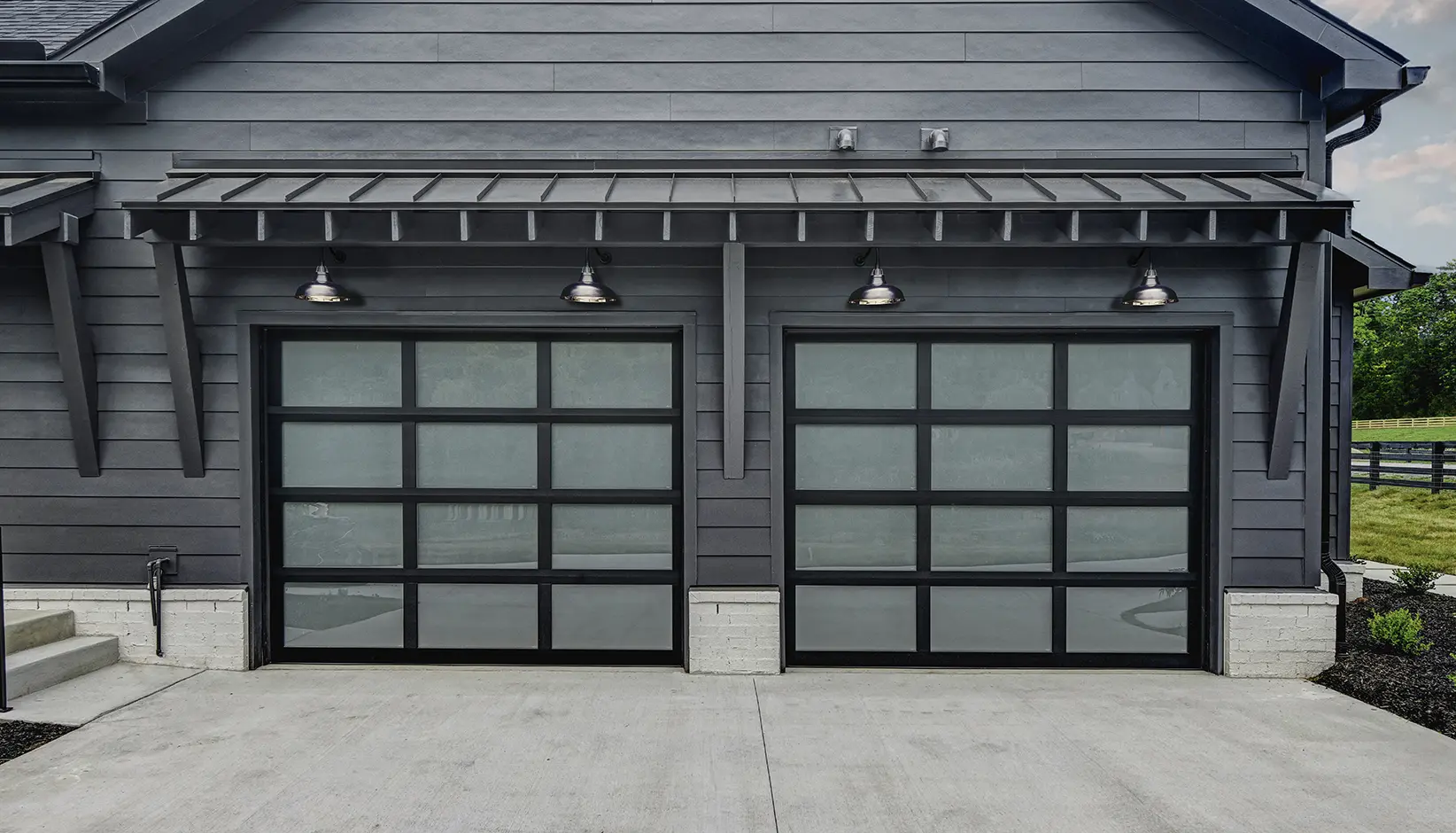 Avante Garage Doors with Black anodized frame with frosted glass