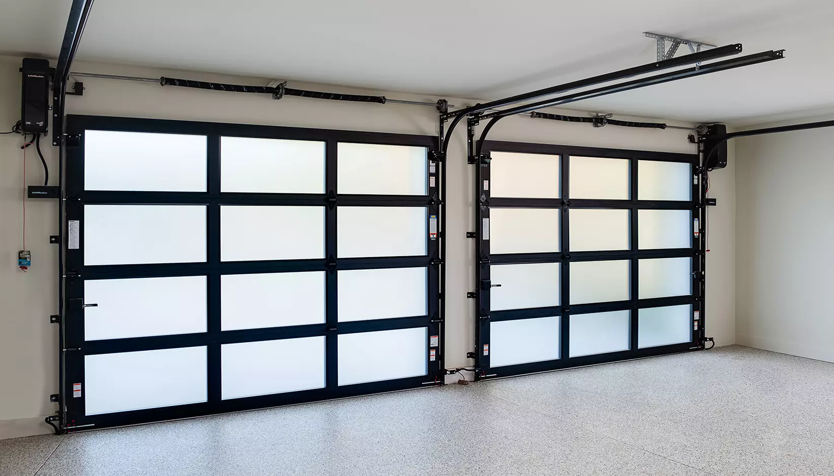 Avante with Black anodized frame, frosted glass panels and black powder coated hardware and track