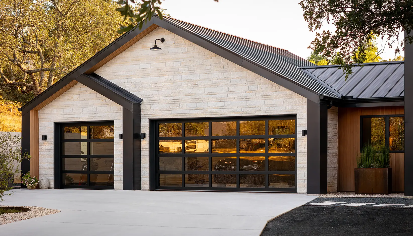Avante garage door with black anodized frame and bronze tinted glass