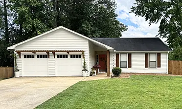 Bridgeport™ Steel garage door with extended panels and REC14 windows in Sherwin Williams Shoji White (SW 7042)