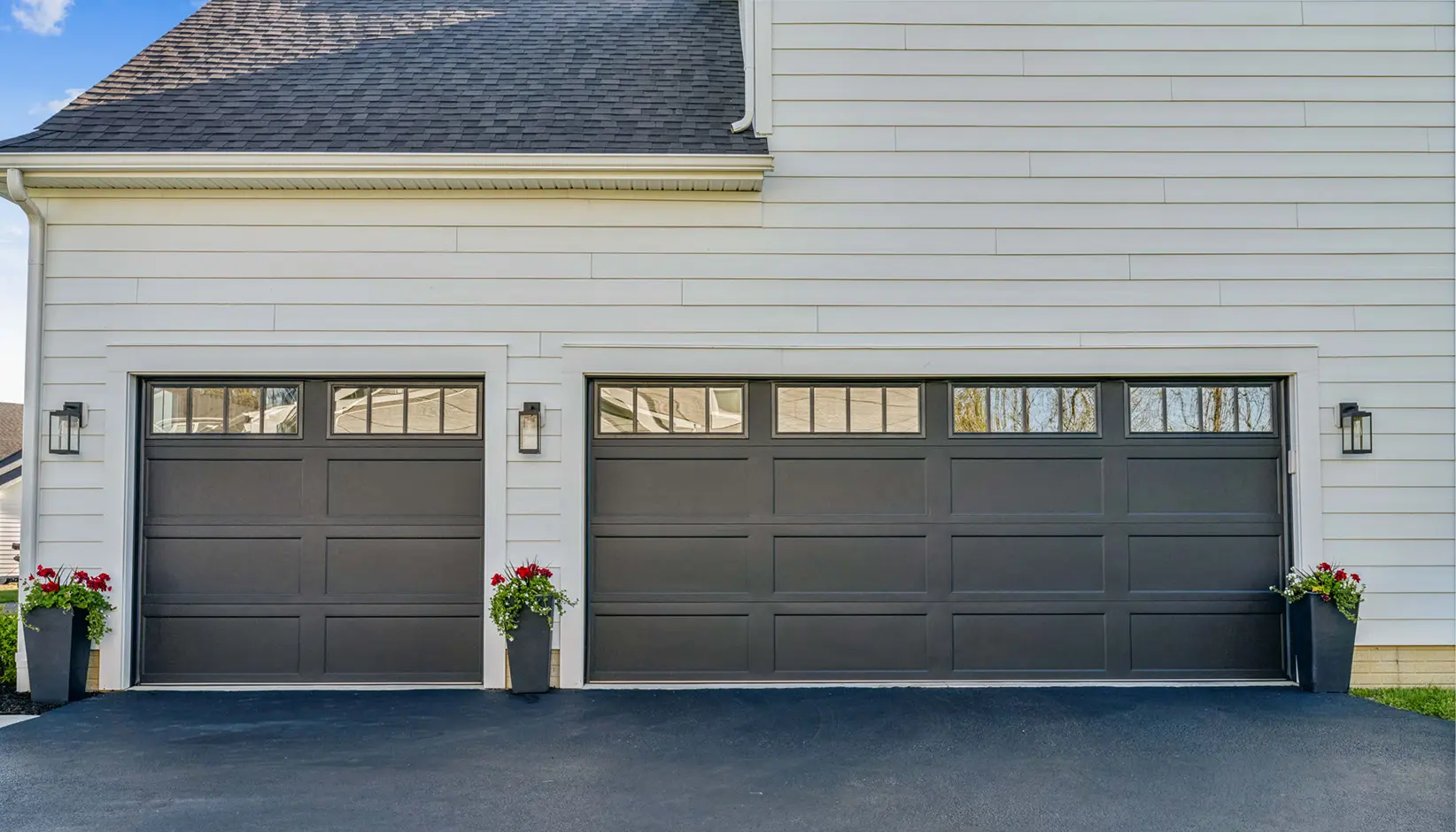 Bridgeport Steel garage door with extended panels and REC14 windows in Lustra™ black