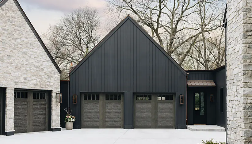 Canyon Ridge® 4-Layer garage door in Design 11 with REC14 windows in Ultra-Grain® Cypress Slate Finish
