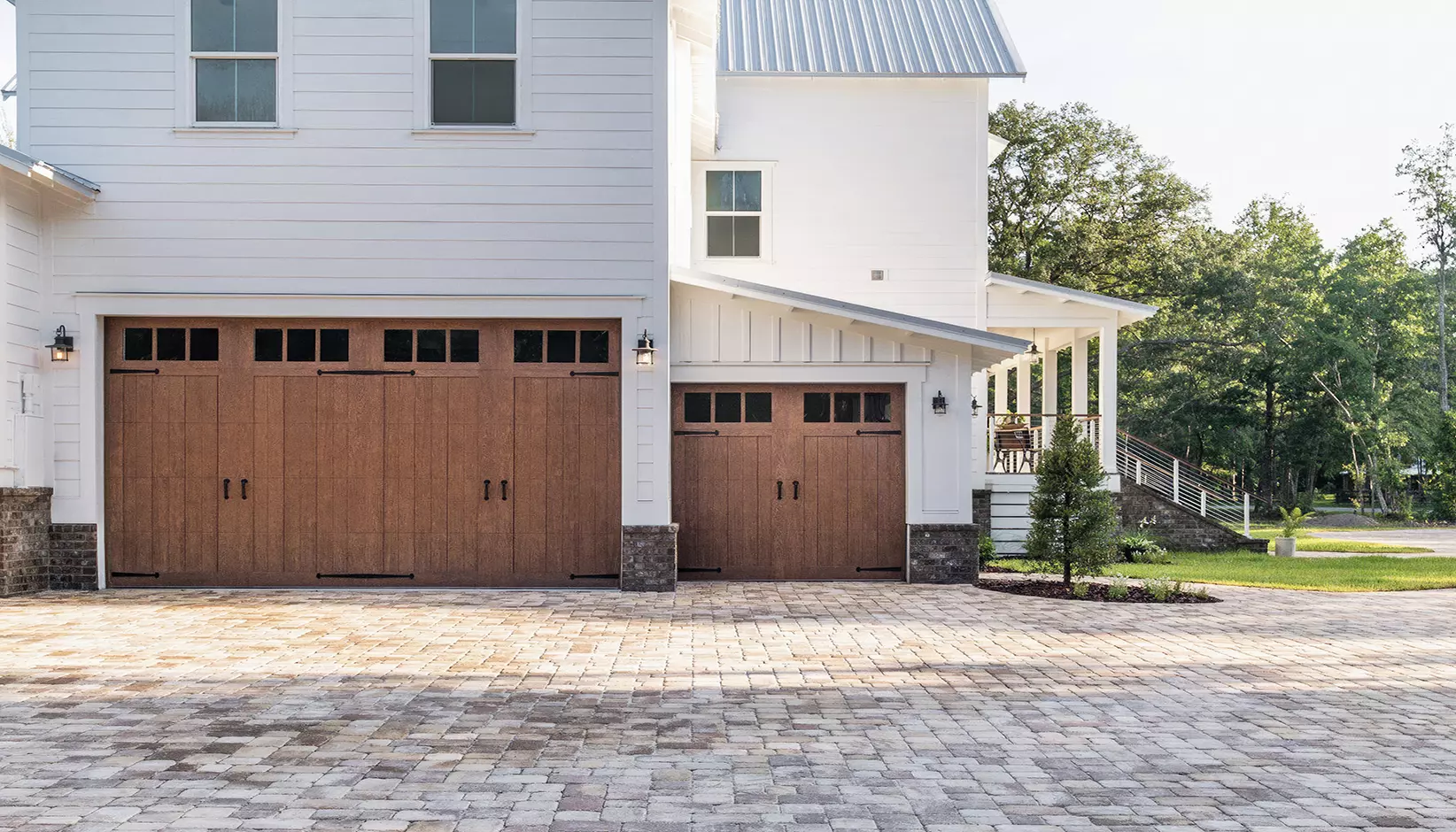Canyon Ridge® 5-Layer garage door in Design 11 with REC13 windows in Medium Finish