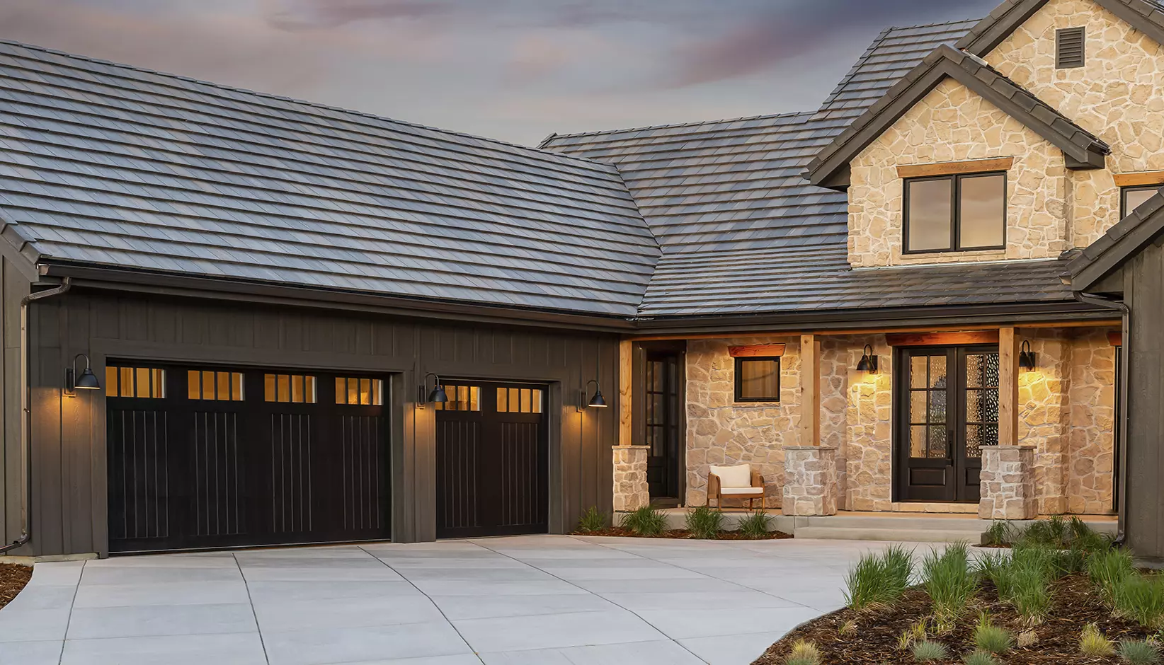 Canyon Ridge 5-layer garage door in Design 11 with REC14 windows in black