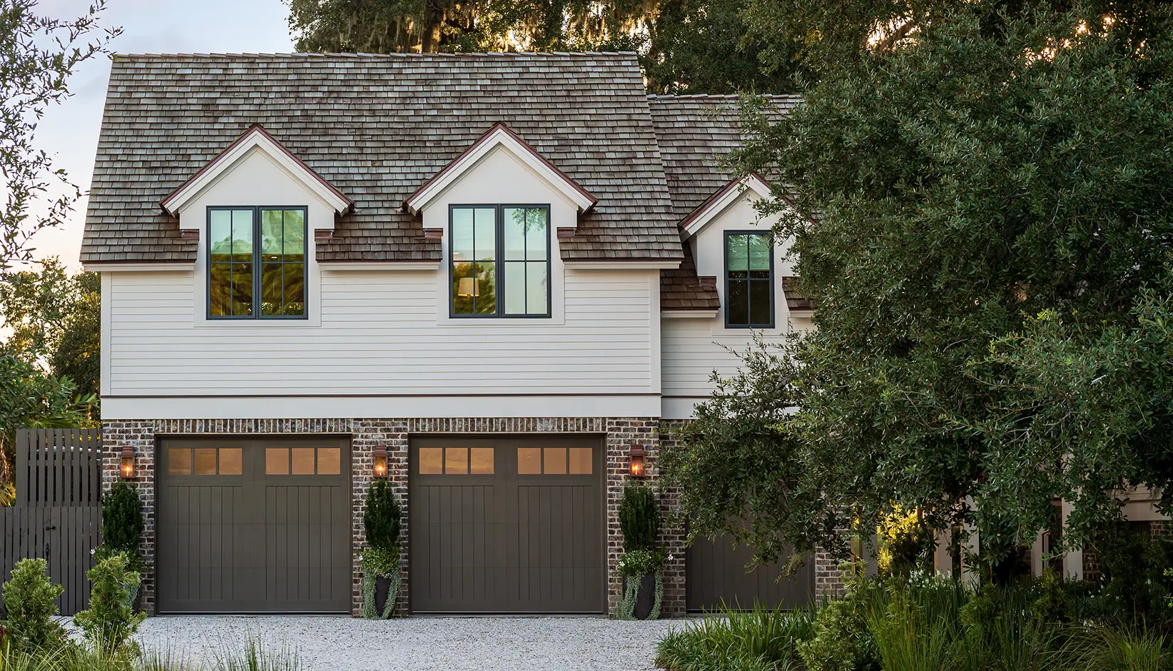 Canyon Ridge® 5-Layer garage door in Design 11 with REC13 windows in Sherwin Williams Porpoise