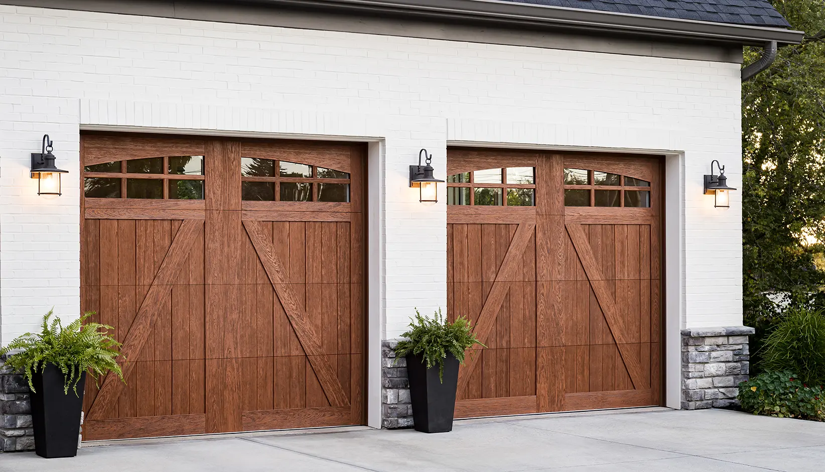Canyon Ridge 5-Layer garage door in Design 22 with ARCH3 windows in Medium Finish