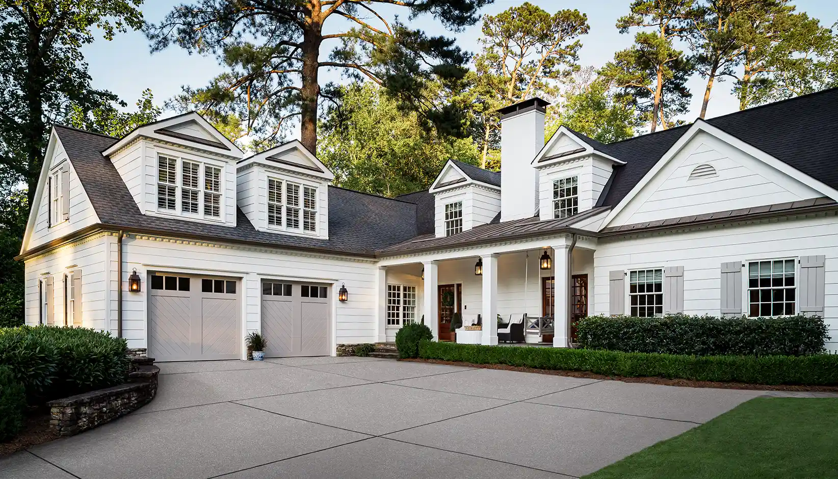 Canyon Ridge Chevron garage door in Design 11 with REC13 windows in Sherwin Williams Requisite Gray
