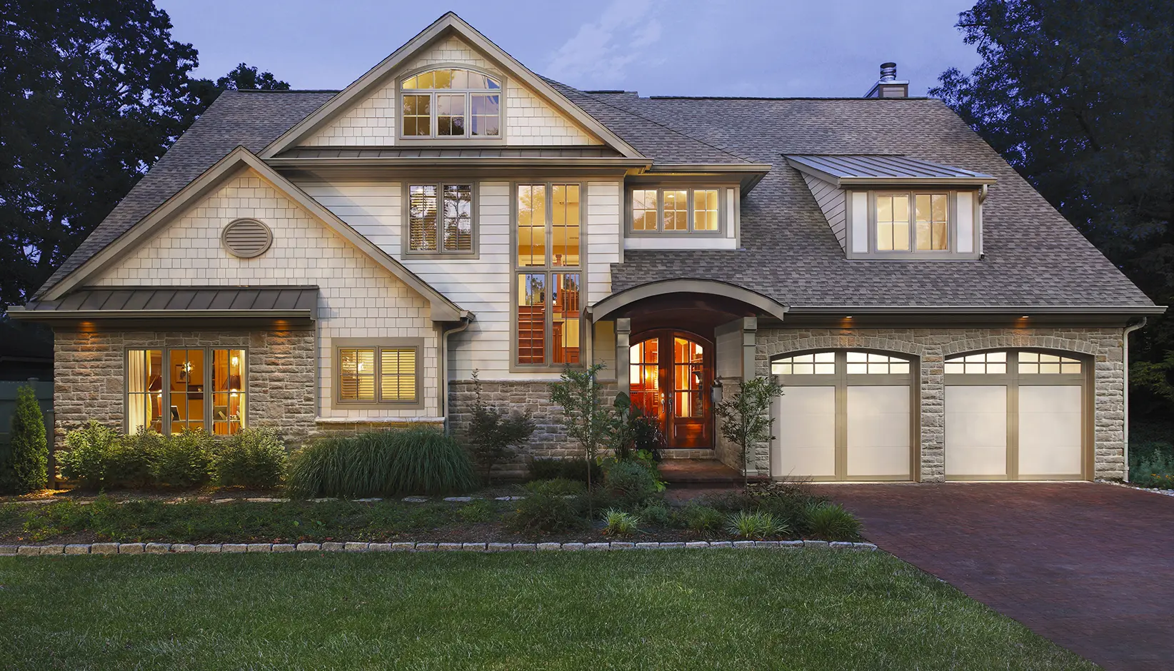 Coachman® garage door in Design 11 with ARCH3 windows in custom color