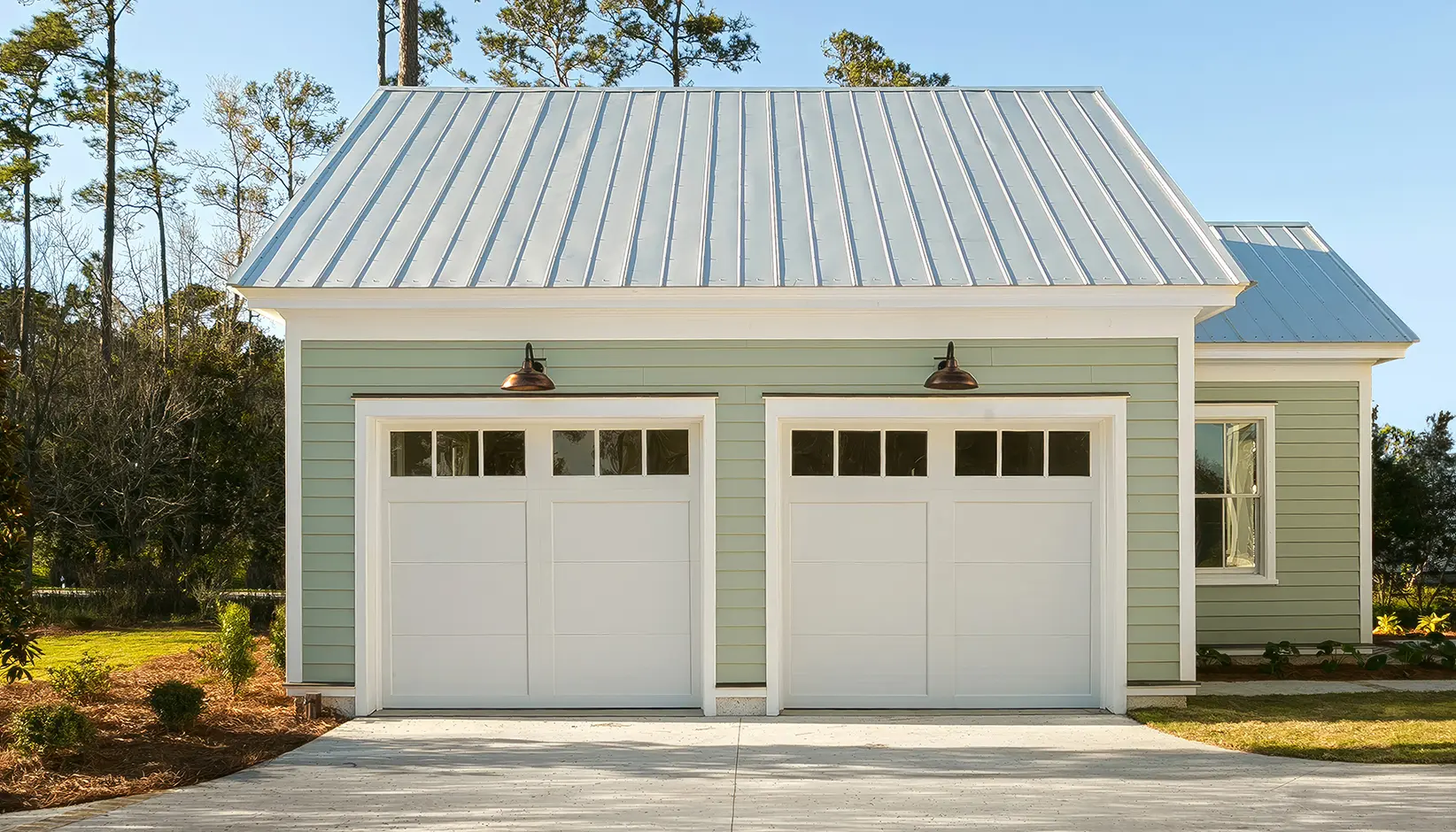 Coachman® garage door in Design 11 with REC13 windows in white