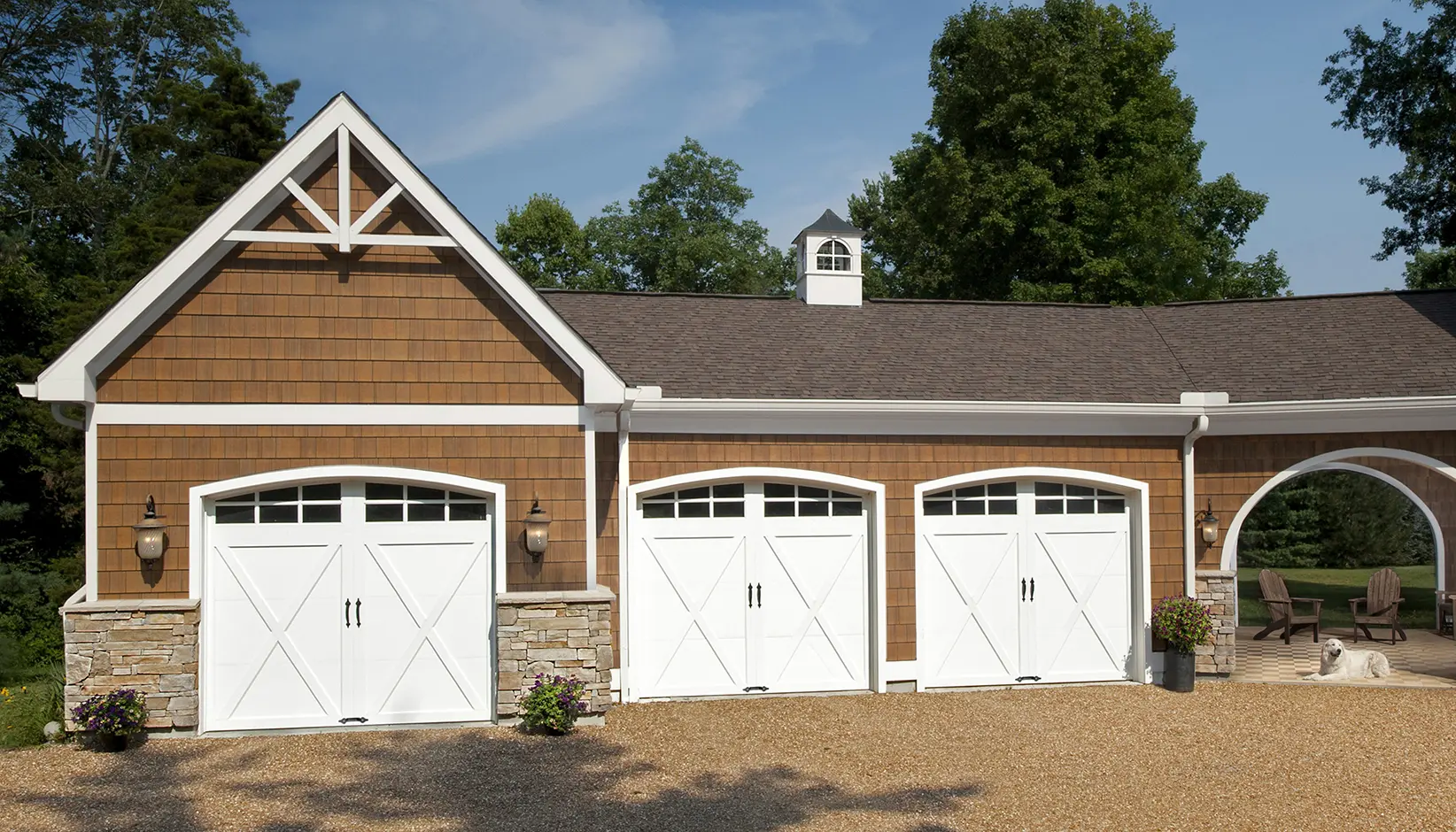 Coachman garage door in Design 21 with ARCH3 windows in White