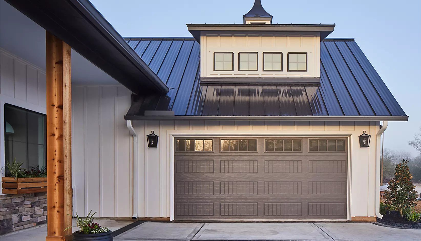 Gallery® Steel garage door with long panels and REC14 windows in Charcoal