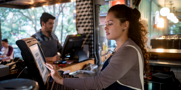 service area woman and man at computers at service area in restaurant